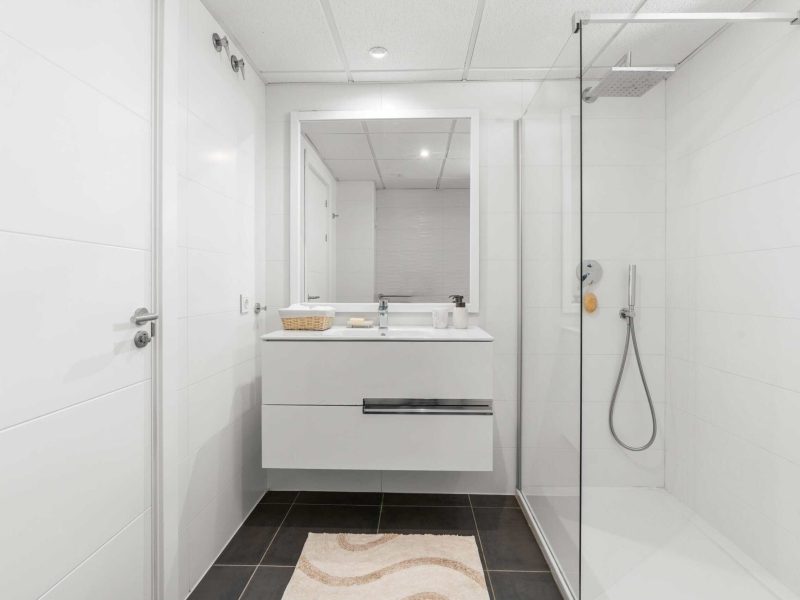 Shower room with a white vanity unit and a walk-in shower