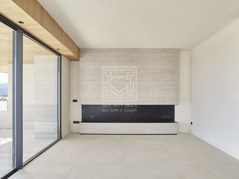 Contemporary living space with natural stone and wood finishes in Santa Eulària