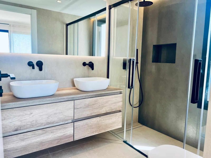 Bathroom with twin basins and a walk-in shower
