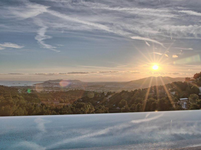 Sunset over Ibiza viewed from the infinity pool in Can Furnet