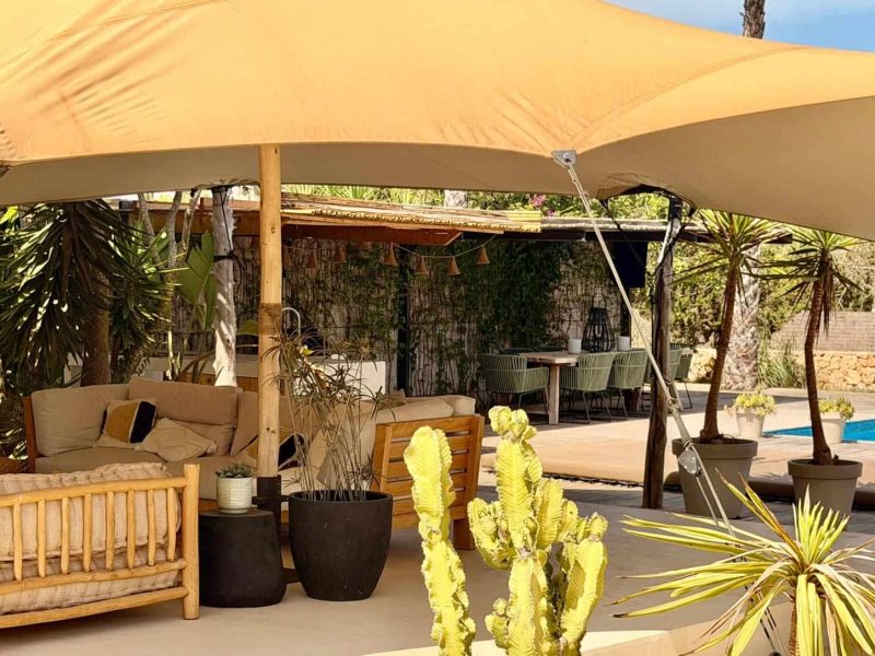 Covered outdoor dining area beside the private swimming pool