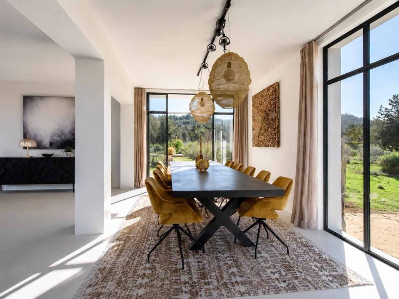 Dining room with floor-to-ceiling windows and countryside views