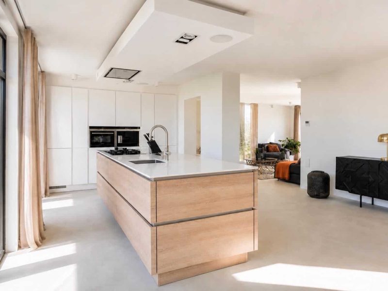 Open-plan kitchen with central island and natural light