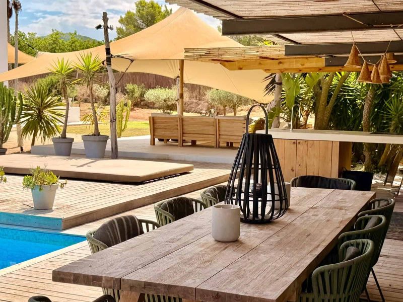 Covered outdoor lounge overlooking the landscaped grounds