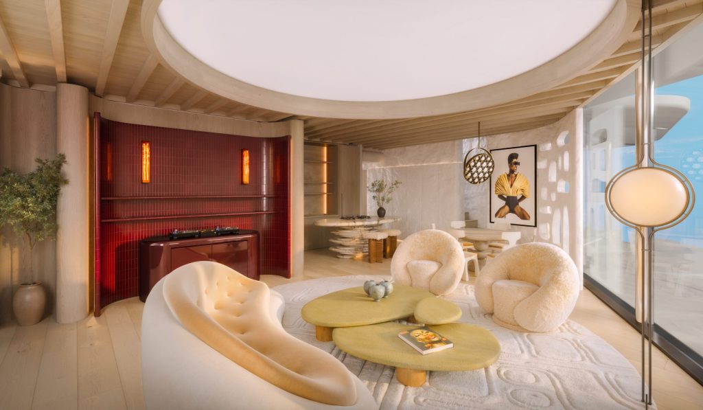 Living space of a Casa Pacha apartment, with curved seating and low sculptural tables