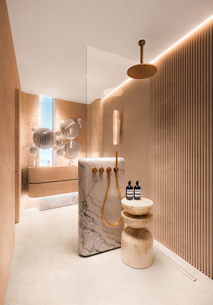 Bathroom of a Casa Pacha penthouse, in fluted oak and stone