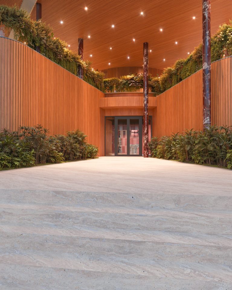 Entrance to Casa Pacha Residences, lined with planting and warm timber