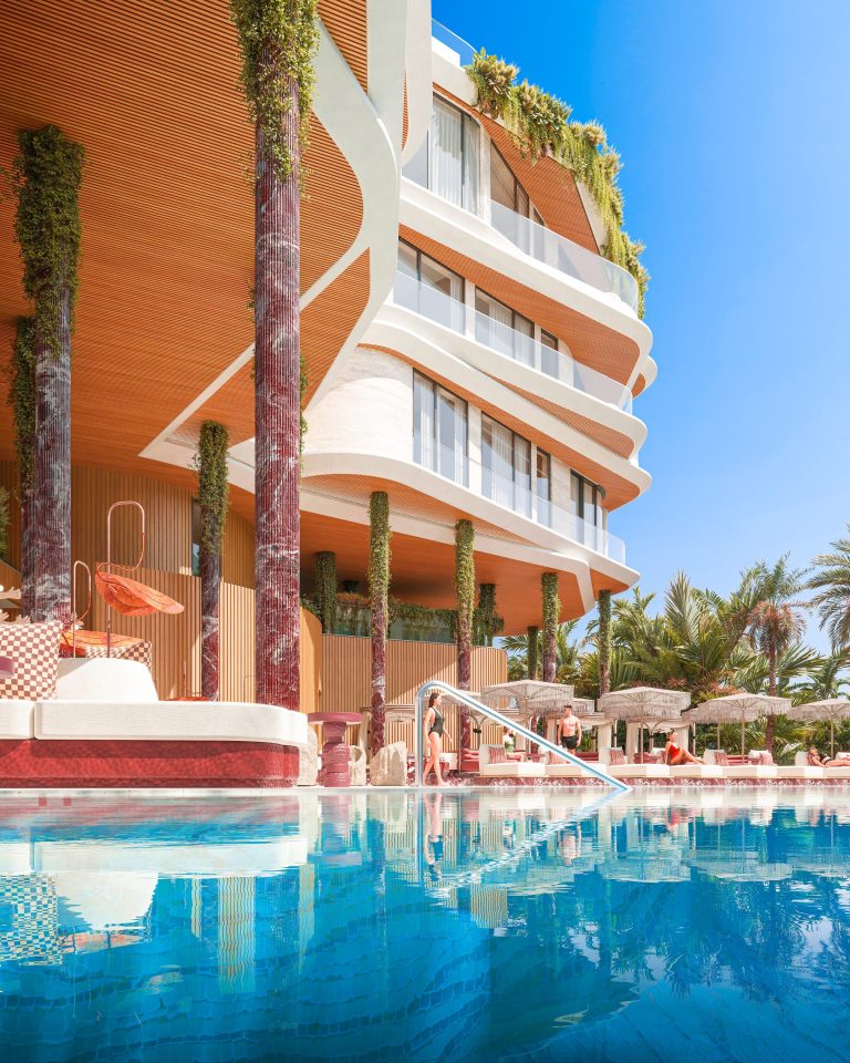 The residence pool at Casa Pacha, with sun beds along the water
