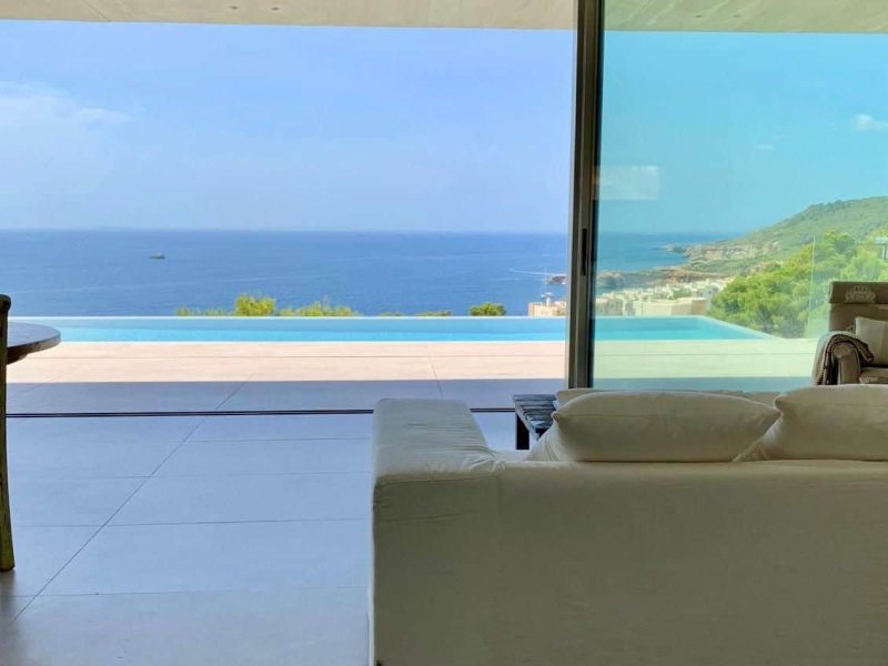 Modern 4-Bedroom Sea-View Villa in Roca Llisa, Ibiza, photo 3 Living room with panoramic sea view in Roca Llisa villa